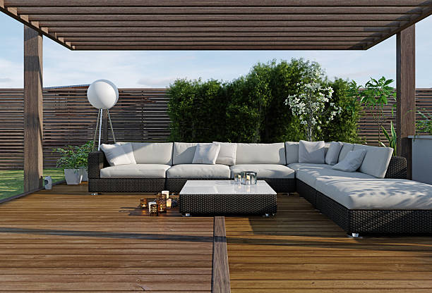 Modern outdoor lounge with stained wooden decking and pergola, and warm wood finish, deck enhancement in Pewee Valley, KY